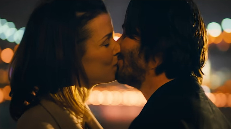 John Wick and Helen kissing