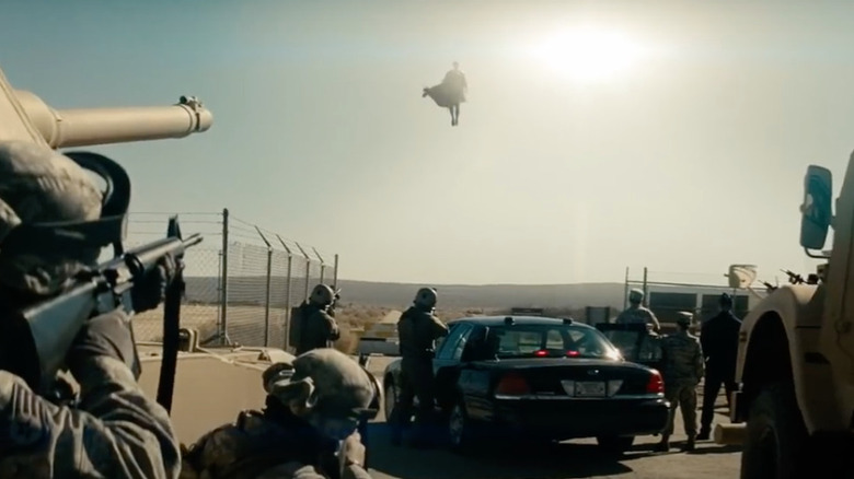 Henry Cavill hovering above the military in "Man of Steel"