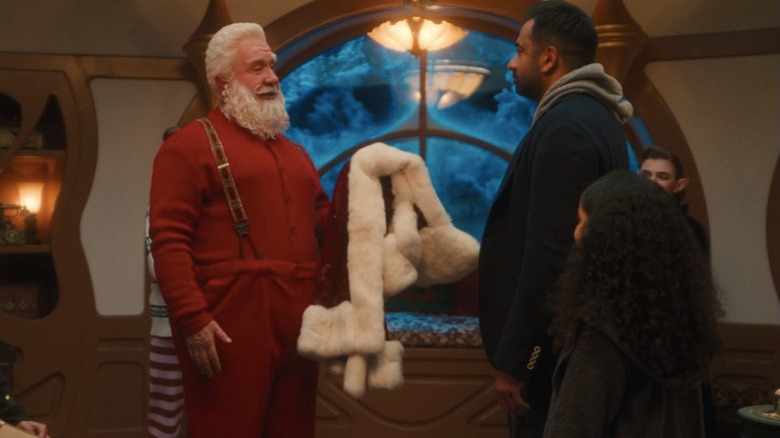 Santa holding coat