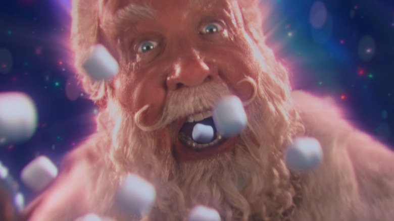 Marshmallows flying into Santa's mouth