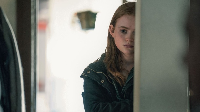 Sadie Sink in a doorway