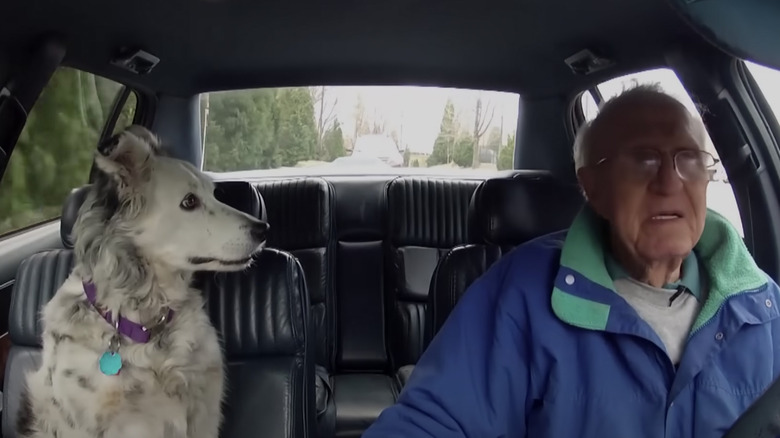 Chaser and her owner in a car