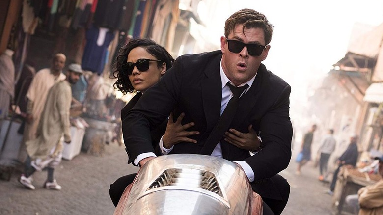 Chris Hemsworth, Tessa Thompson on motorcycle