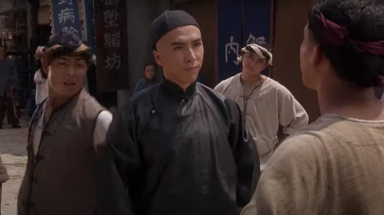 Young Donnie Yen facing down an opponent