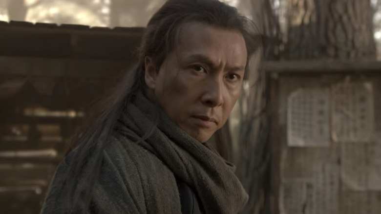 Donnie Yen with long hair and scarf