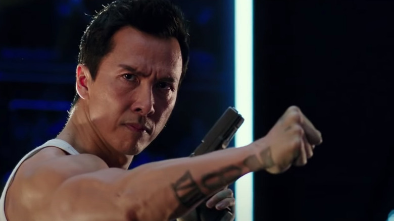 Donnie Yen posing with gun