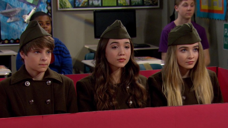 Riley, Farkle, and Maya dressed as communists