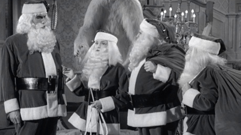 Addams family dressed like Santas