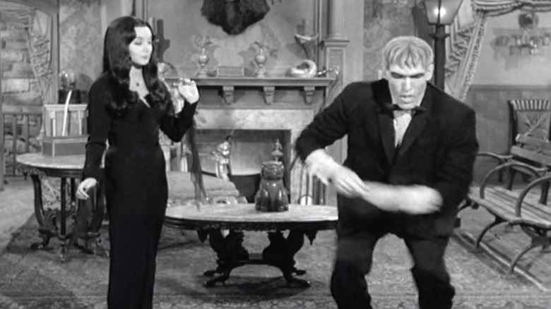 Lurch and Morticia dancing