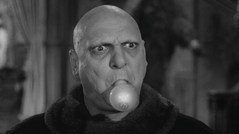 Uncle Fester with lightbulb in mouth