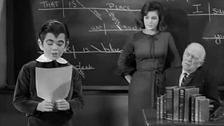 Eddie Munster reading in class