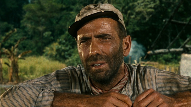 Humphrey Bogart sweaty and disheveled in his boat