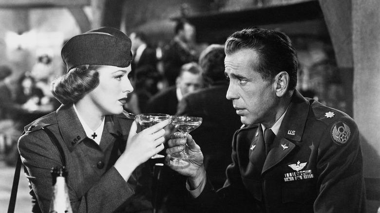 Humphrey Bogart and Eleanor Parker share a drink