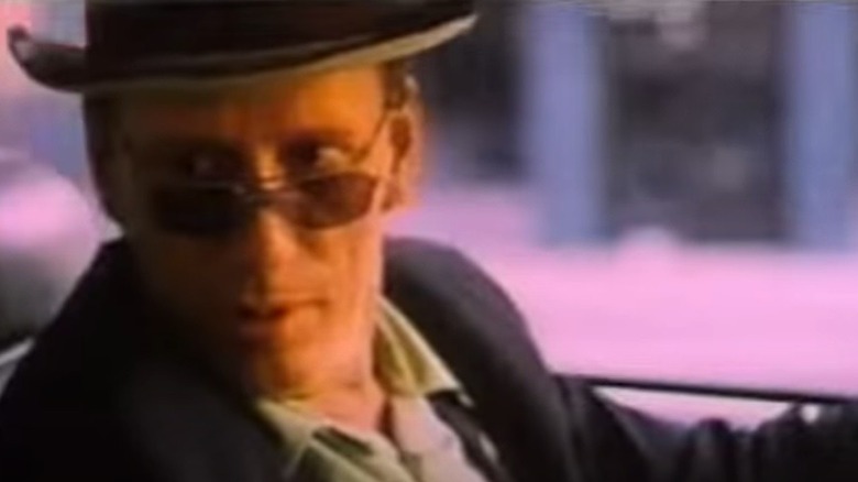 James Woods in hat and glasses