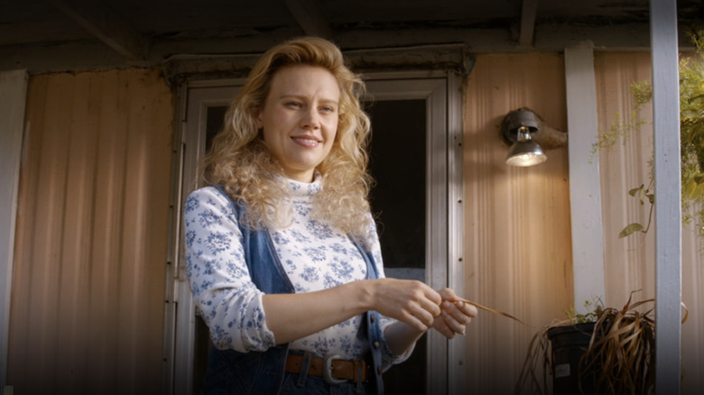 Kate McKinnon caressing a plant in "Masterminds"