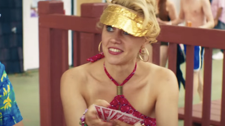 Kate McKinnon playing cards in "Staten Island Summer"