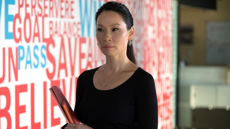 Lucy Liu in an office