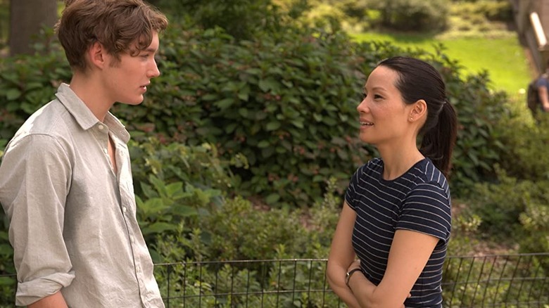 Liu speaks to a young man