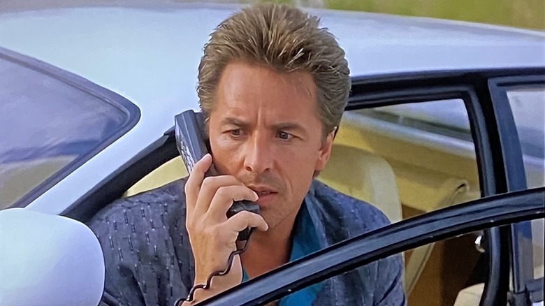 Don Johnson on a car phone