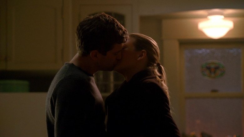 Peter and Olivia kissing