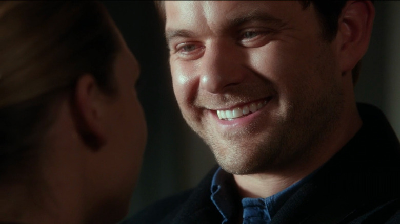 Peter grinning at Olivia