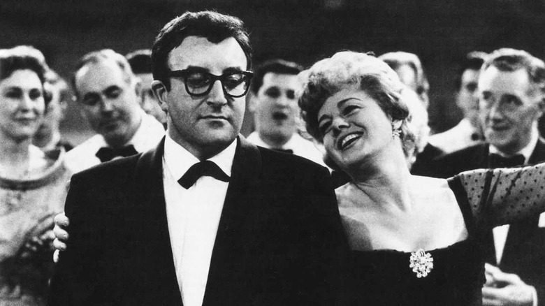 Peter Sellers scowls while dancing