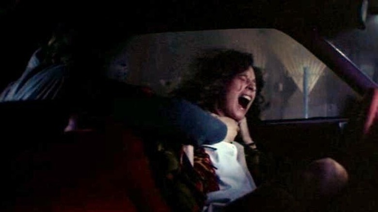 Michael attacks Annie in her car