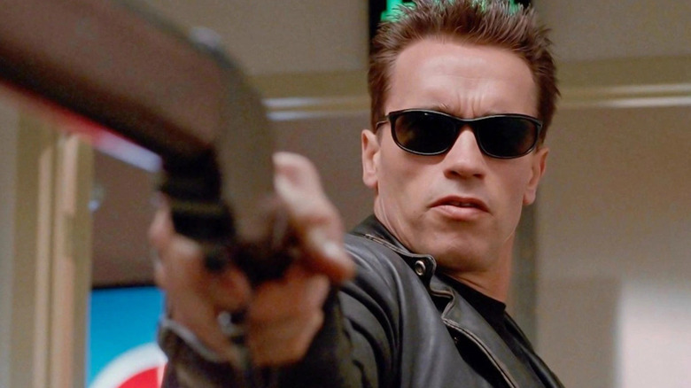 The T-800 aims a shotgun