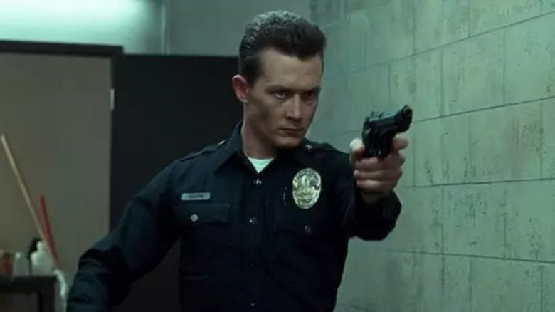 The T-1000 aims its pistol