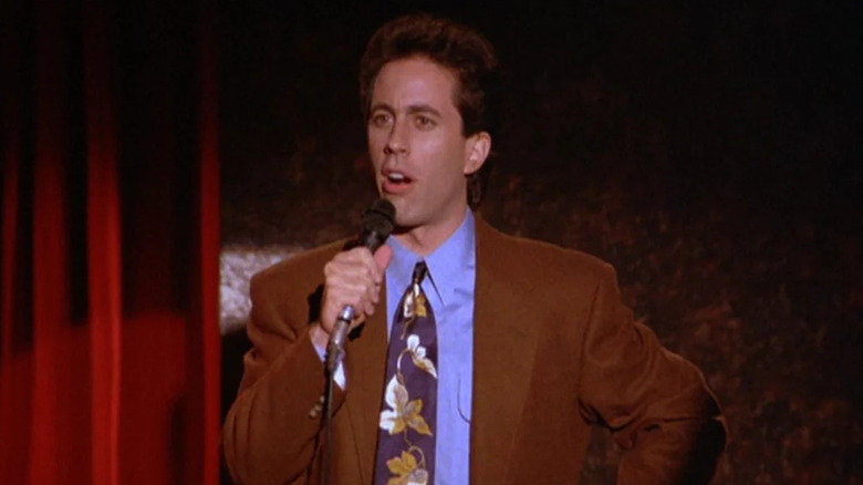 Jerry performs standup on stage