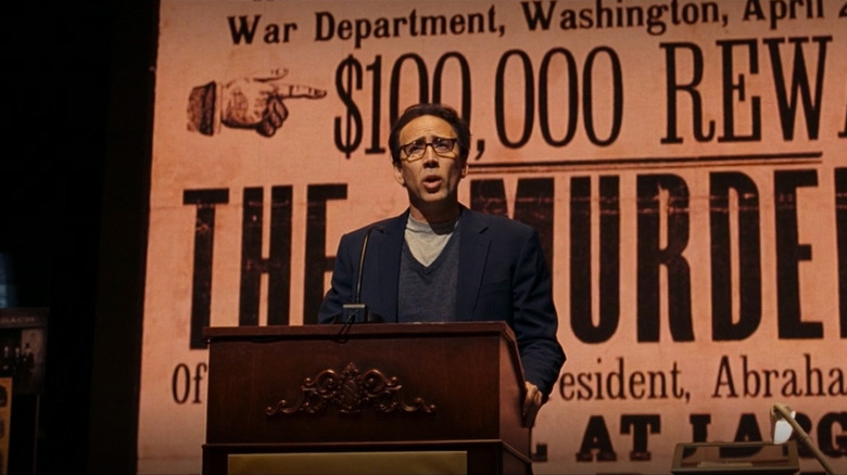 Ben speaking at a lectern