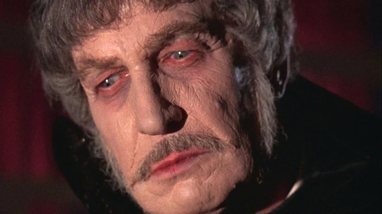 Dr. Phibes frowning