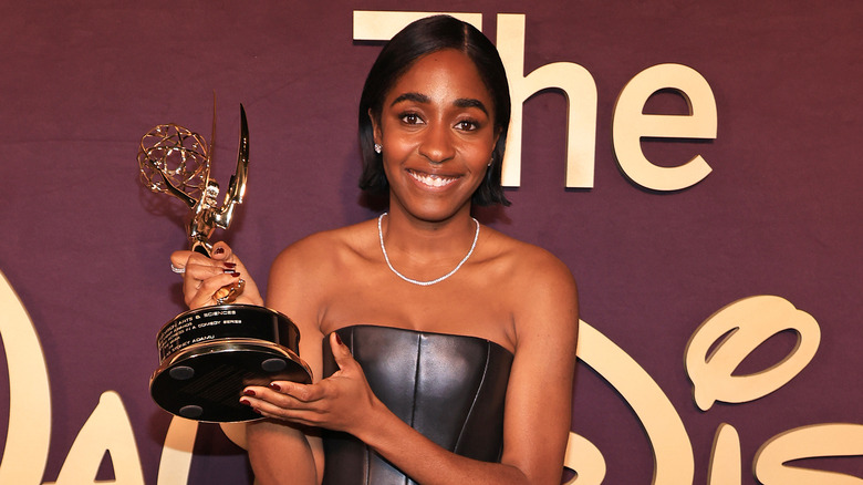 Ayo Edebiri holding her Emmy