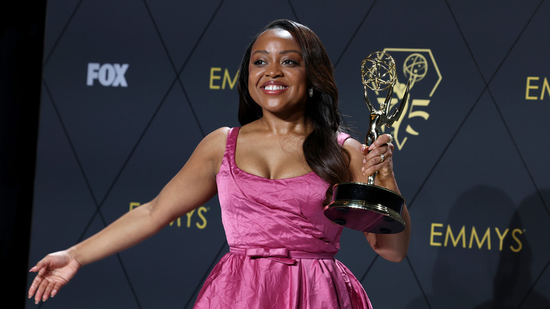 Quinta Brunson poses with Emmy