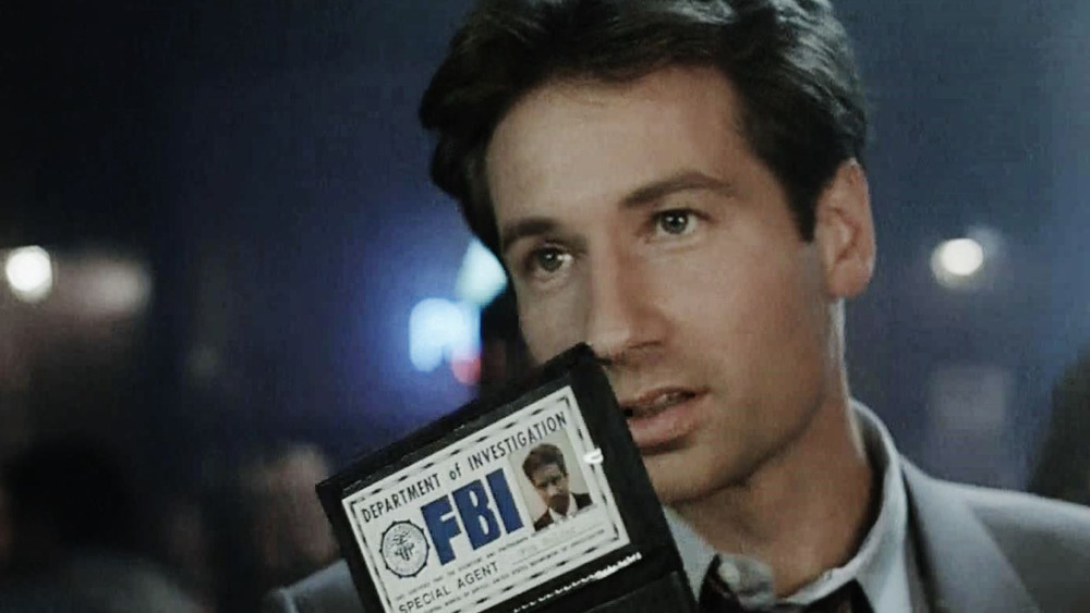 Fox Mulder shows his badge