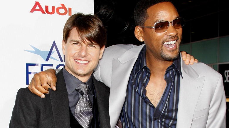 Tom Cruise and Will Smith smiling