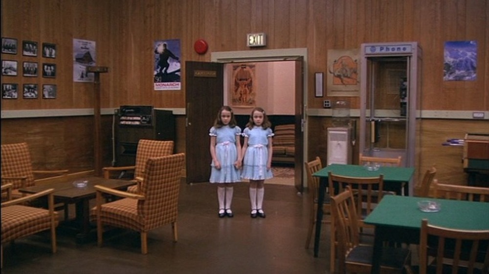 Grady Twins standing by exit door