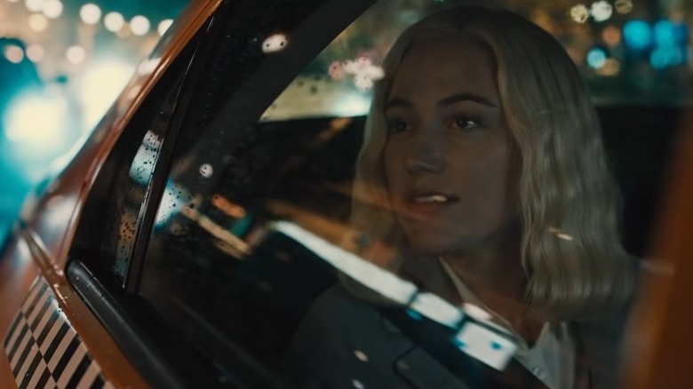 Maika Monroe watches as Julia in Watcher