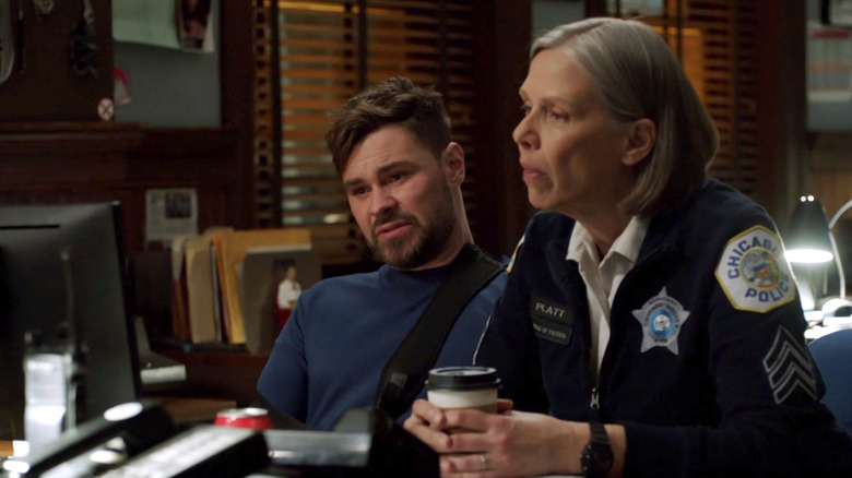 Ruzek and Platt look at case file