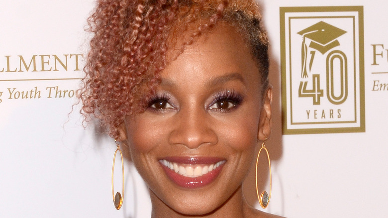 Anika Noni Rose smiling on red carpet 