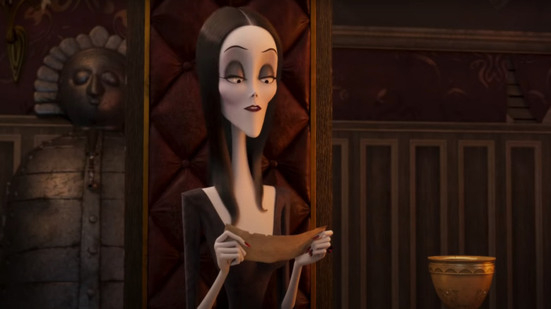 Morticia reading a letter