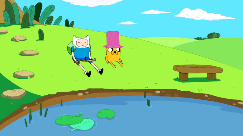 Finn and Jake sitting by a lake together