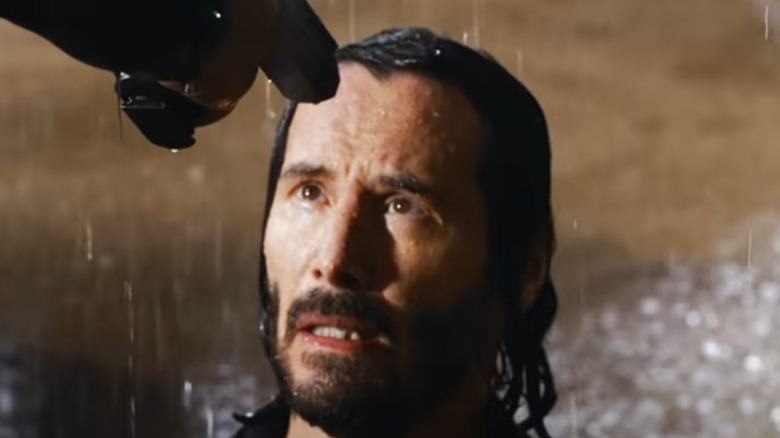 Keanu Reeves with gun to head