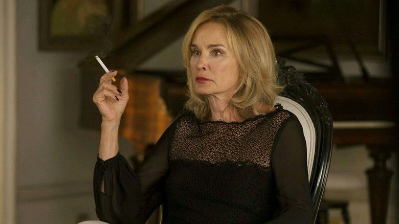 Fiona Goode smokes a cigarette