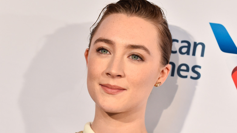 Saoirse Ronan looks left