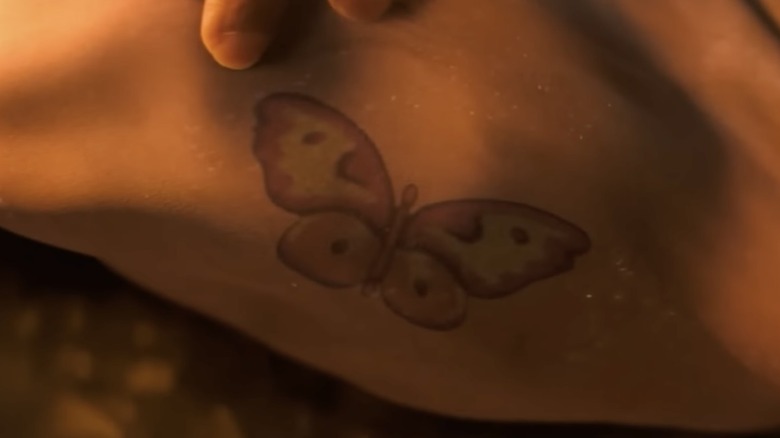 Neville finds butterfly tattoo