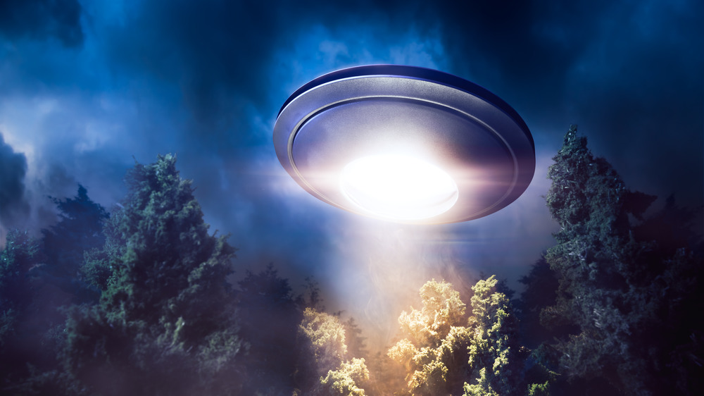 UFO flying over forest