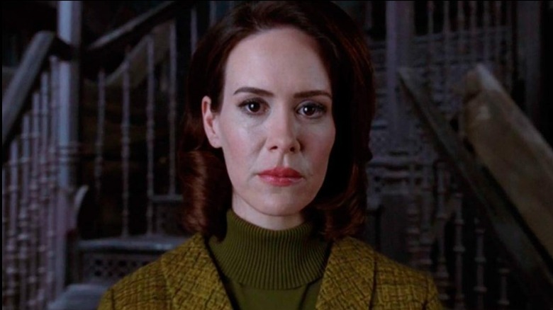 Lana Winters looks at camera