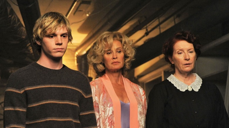 Evan Peters, Jessica Lange, and Frances Conroy looking down