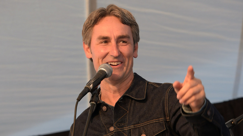 Mike Wolfe speaking in a microphone